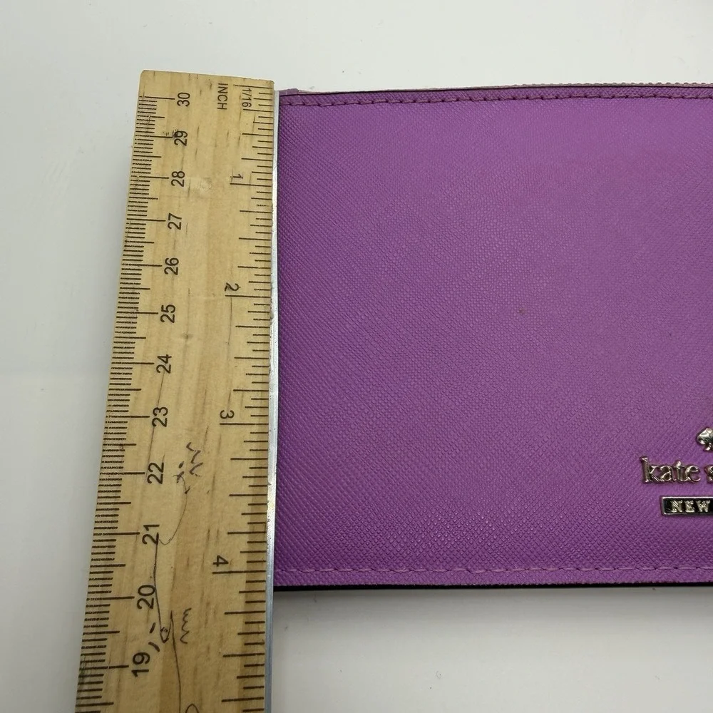 Kate Spade New York purple leather wristlet.